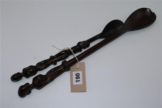 Two African carved hardwood figural spoons(-)